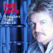Der musikalische text THIS TIME LAST YEAR von JOE DIFFIE ist auch in dem Album vorhanden Tougher than nails (2004)