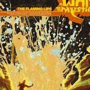 Der musikalische text THE WIZARD TURNS ON... THE GIANT SILVER FLASHLIGHT AND PUTS ON HIS WEREWOLF MOCCASINS von THE FLAMING LIPS ist auch in dem Album vorhanden At war with the mystics (2006)