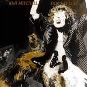 Der musikalische text DOG EAT DOG von JONI MITCHELL ist auch in dem Album vorhanden Dog eat dog (1985)